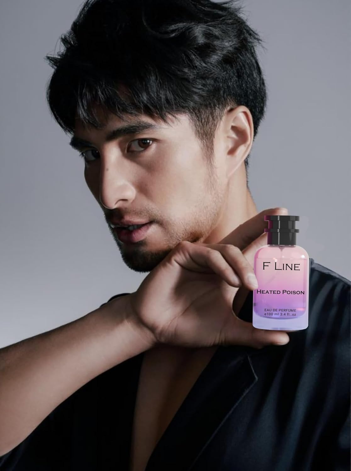 F Line Heated Poison Unisex Luxury Perfume Bottle Held by a Model for a Sophisticated Fragrance Experience
