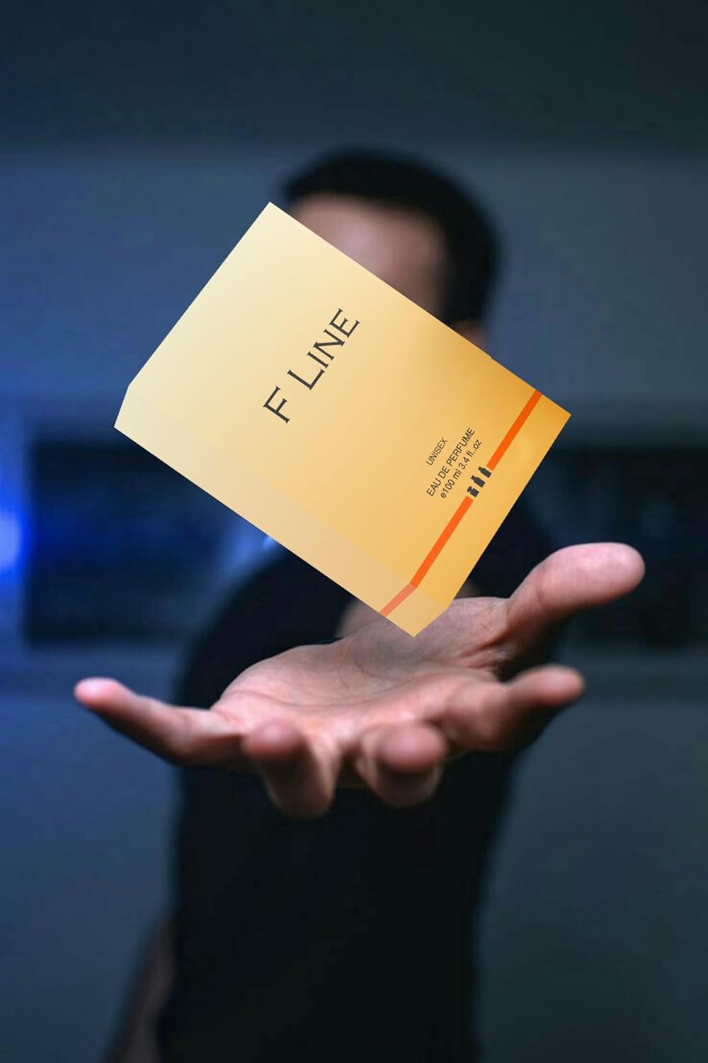 F Line unisex long-lasting perfume packaging held in hand with a soft background blur